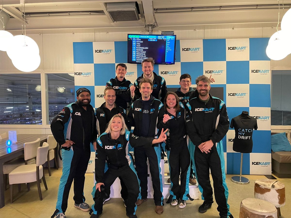 The Koalitix team in racing suits after ice karting.